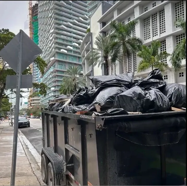 Junk removal Brickell — trailer loaded with bagged debris from a Brickell-area job