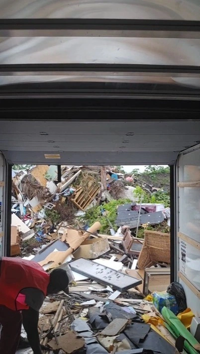 Junk removal crew loading a truck in Miami