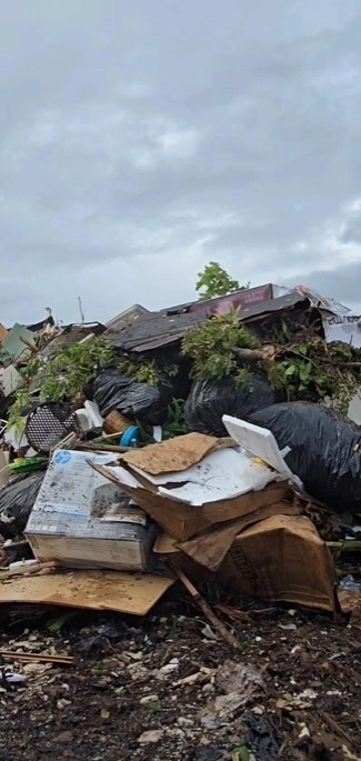 Large outdoor pile of mixed junk and debris cleared during a Pinecrest estate-lot cleanout