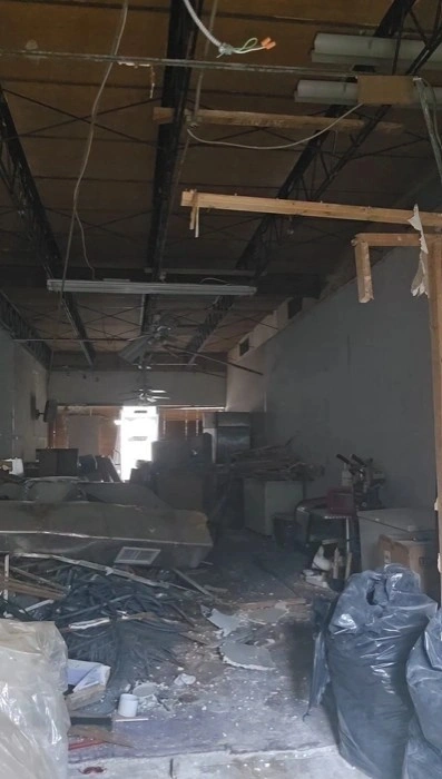 Gutted interior room with storm or water damage debris cleared in Miami